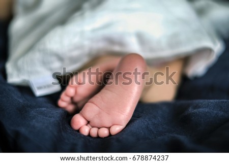 Soft newborn baby feet