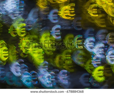 Beautiful background with different colored symbol euro, abstract background, euro symbol shapes on black background, bokeh