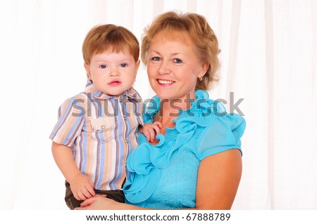 Grandmother and grandson spend time together. Symbol of the family.