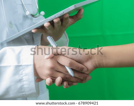soft blurred doctor agree with patient for treatment on green background
