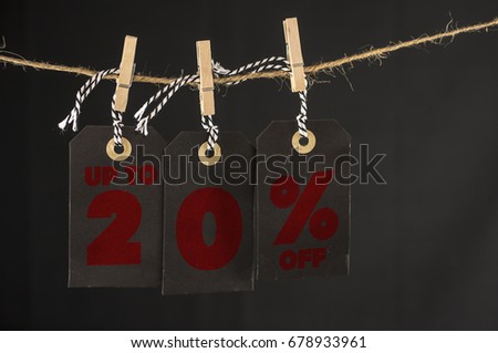 Close up shot of hanging tags that assemble 20 percent discount