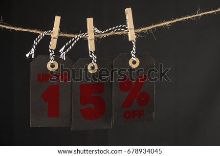 Close up shot of hanging tags that assemble 15 percent discount
