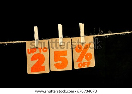 Close up shot of hanging tags that assemble 25 percent discount