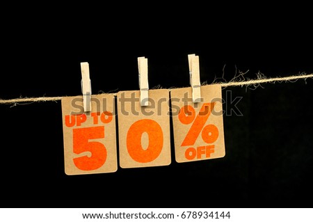 Close up shot of hanging tags that assemble 50 percent discount