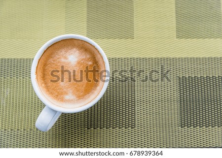 Cup of coffee on table background in morning