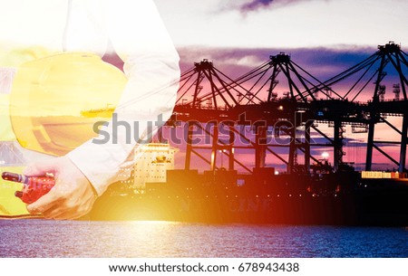 engineering man standing with white safety helmet against Business Logistics concept,Truck in container depot in import and export area at port,Container Cargo freight ship for Logistic Import Export
