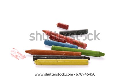 Grunge wax pastel crayons and drawings isolated on white background