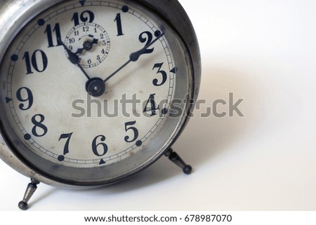 old clock on a white background. Interior shot. Nobody