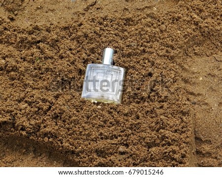 Bottle in the sand.