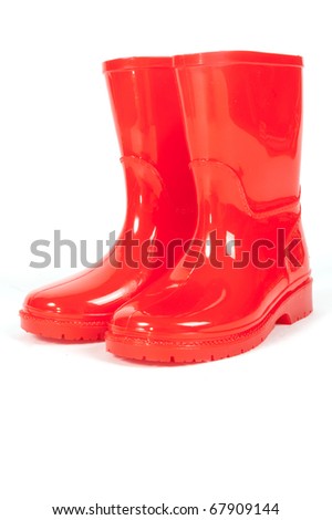 A pair of red rainboots on a white background Royalty-Free Stock Photo #67909144