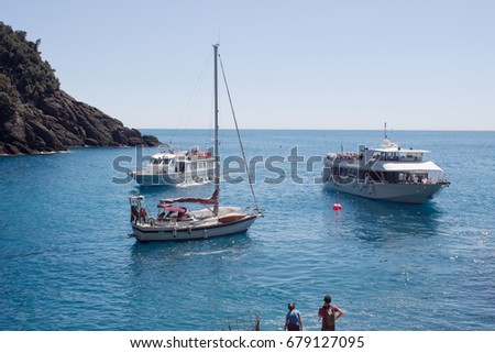 Picture of row of luxury sailboats reflected in water, yacht port on the bay, water transport, ocean transportation, beautiful vessel in the harbor, summer vacation, active lifestyle, holiday concept