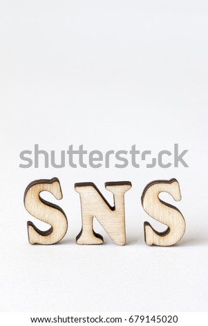 SNS,Alphabet made with wooden board.social networking service