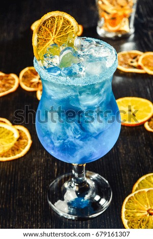 blue lagoon cocktail on dark background