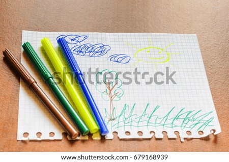 Children's picture with felt-tip pens, the sun. Four felt-tip pen