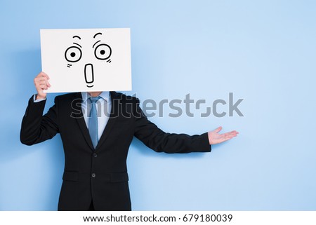 businessman take billboard and show something on blue background