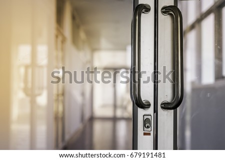 Blank glass door with metal handles. Entrance. Opened luxury hall doorway with transparent surface 