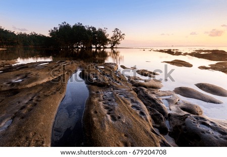 View of beautiful sunrise at Tip of Borneo Malaysia. Image may contain soft focus and blur due to long expose.