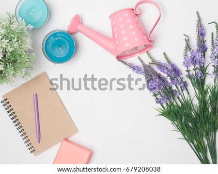 Flat lay, top view office table desk frame. feminine desk workspace with laptop, watch on white background.Love concept top view composition.note for something in love emotion.Watering can pink color.
