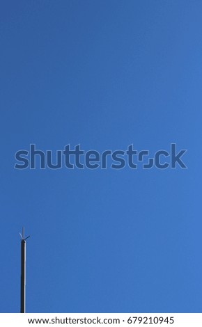 Lightning rod with blue sky background