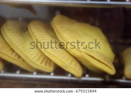Jamaican Patties On Grill Royalty-Free Stock Photo #679215844