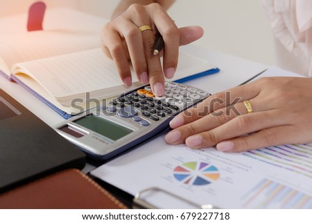 Businessman check profit document and calculate about and note data cost at home ,Finance managers task,Currency investment that think carefully. Concept business and finance