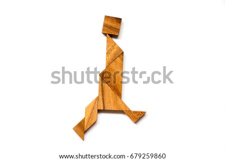 Wooden tangram puzzle in walking man shape on white background
