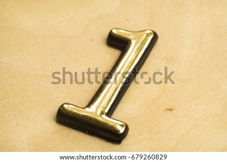 Close up of Gold Numeral Character Sign