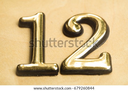 Close up of Gold Numeral Character Sign