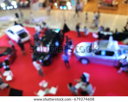 Abstract blur and defocused topview car showroom in department store for background