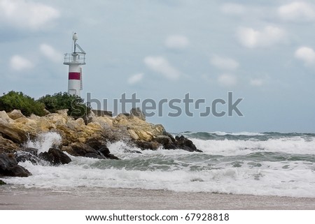 Lighthouse landscape in a stormy weather