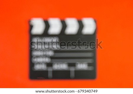 Blur, Clapperboard, Film production and movie making concept, on orange background