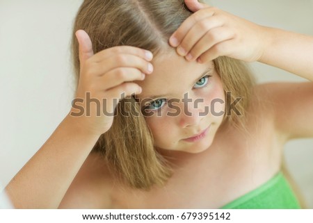 The girl has a problem with her hair