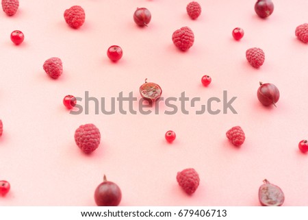 Top View Picture of mix of berries isolated over pink background table.