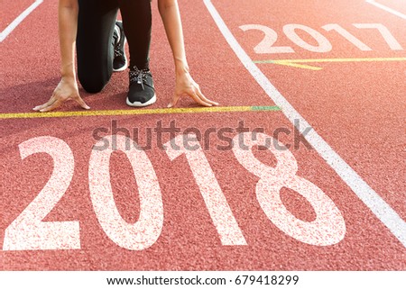 Athlete Starting line waiting start running track with text 2018 year, Start to new year next future Royalty-Free Stock Photo #679418299