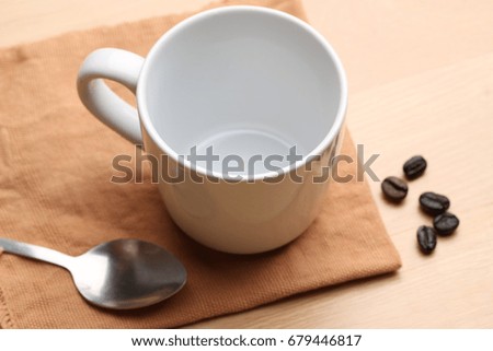empty white coffee cup on wood background