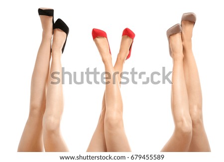 Beautiful female legs isolated on white