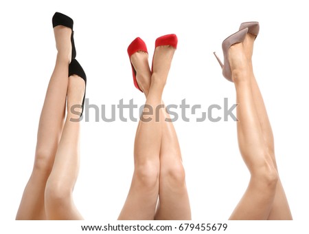 Beautiful female legs isolated on white