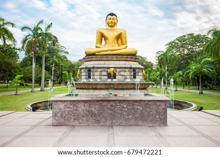 Buddha statue at the Viharamahadevi Park or Victoria Park, public park located in Colombo near the National Museum in Sri Lanka