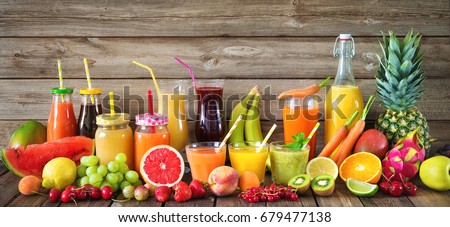 Various freshly squeezed fruits and vegetables juices Royalty-Free Stock Photo #679477138