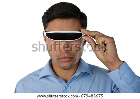 Close up of businessman using smart glasses against white background