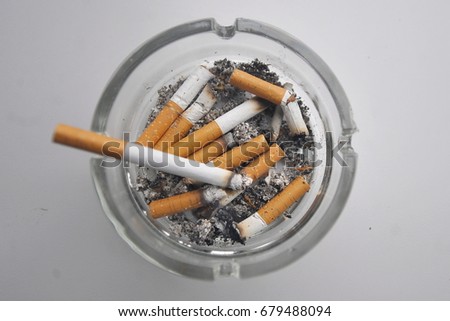 Cigarettes in an ashtray Royalty-Free Stock Photo #679488094
