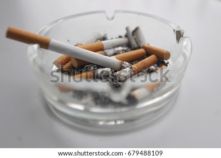 Cigarettes in an ashtray Royalty-Free Stock Photo #679488109