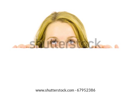 Portrait of a beautiful blond woman holding a blank billboard