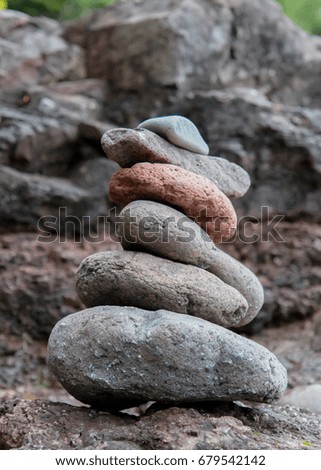 Stack of rocks along rocky beach Royalty-Free Stock Photo #679542142