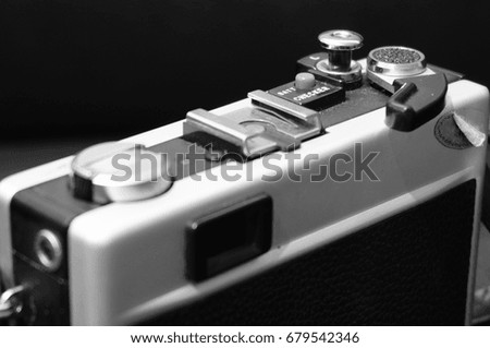 Black and white image of an old manual camera