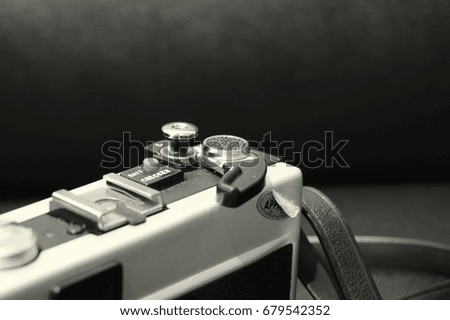 Black and white image of an old manual camera