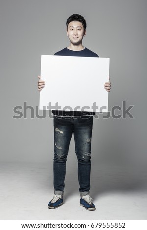 A man hand hold a blank(empty) board isolated white.