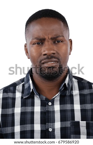 Thoughtful man standing against white background