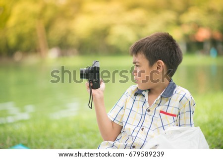 Single father and son taking camera together with happy smile