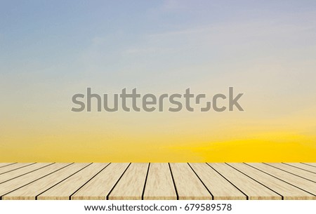 wooden table with sky at sunset background